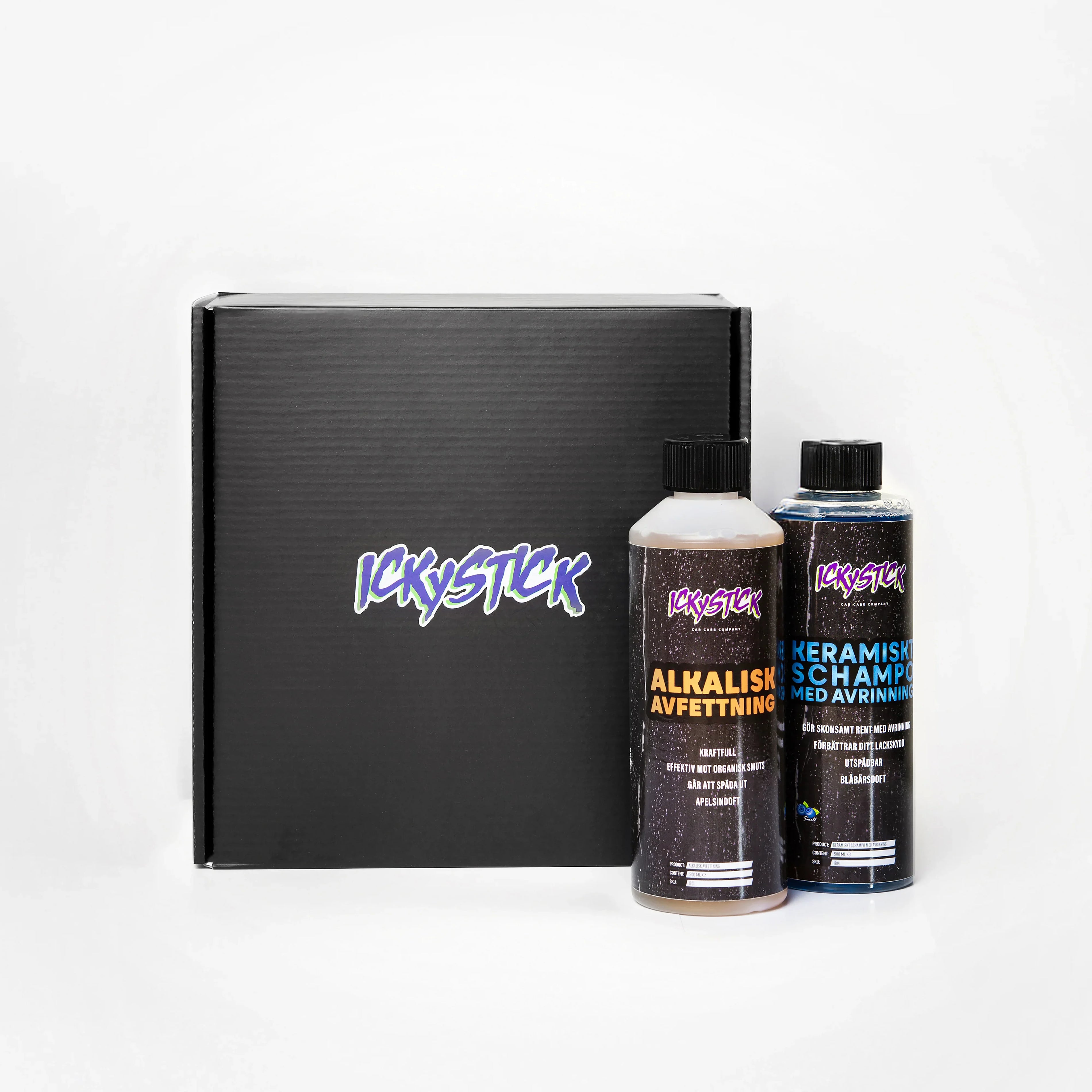 Car care kit with alkaline degreaser and ceramic shampoo bottles in front of black box
